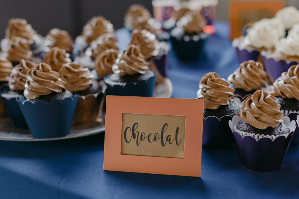 chocolate cupcakes on navy table