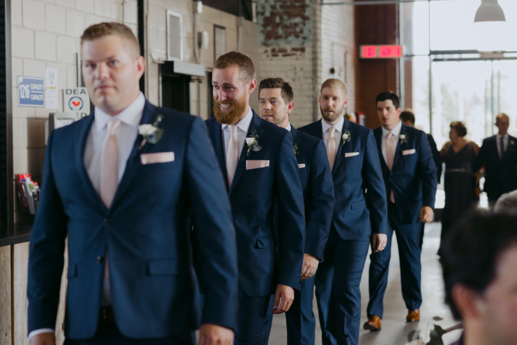 groomsmen walking down the aisle