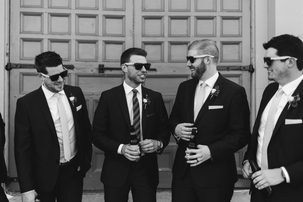groom and groomsmen drinking beers outside the Aberdeen Pavilion