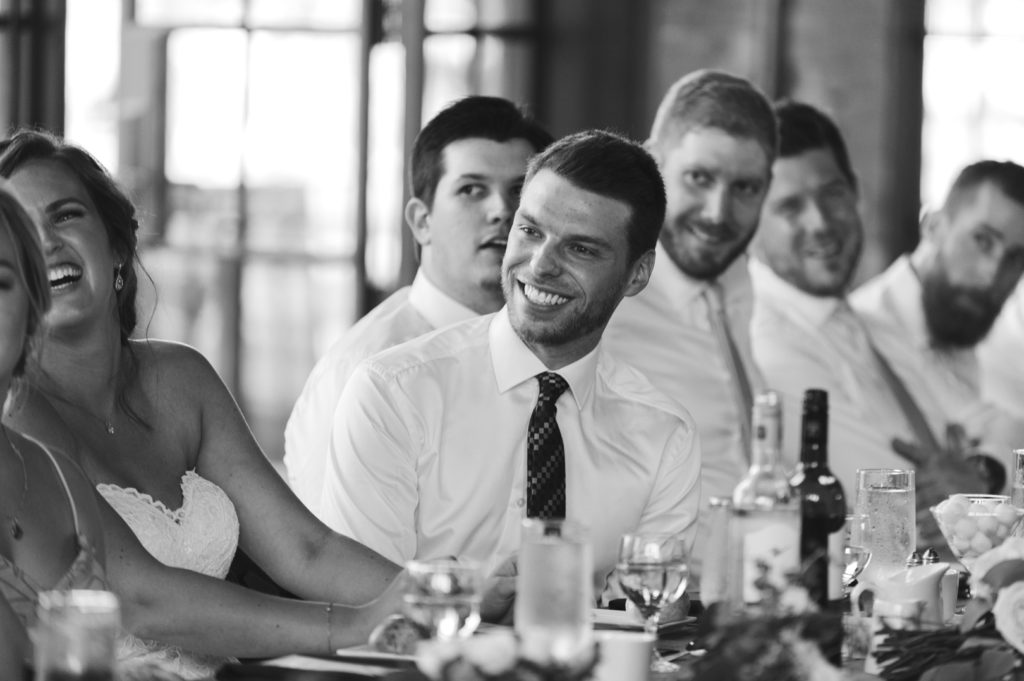 groom laughing at speeches