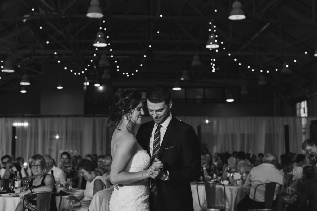 black and white photo of the bride and groom first dance
