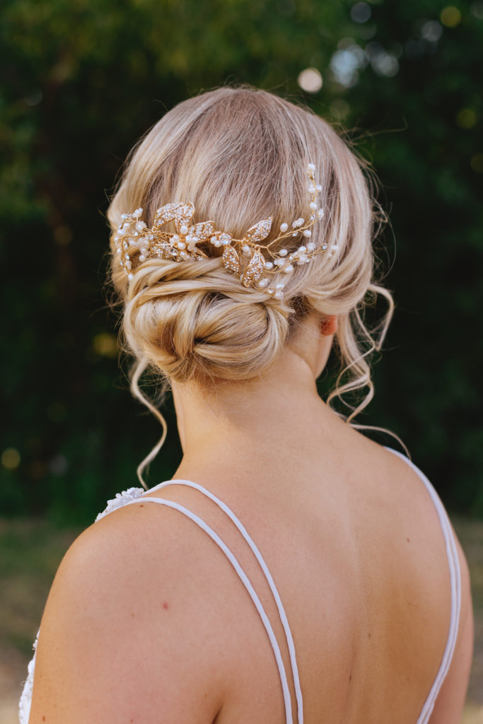 bridal up-do with hair piece by the hair hustle in Ottawa