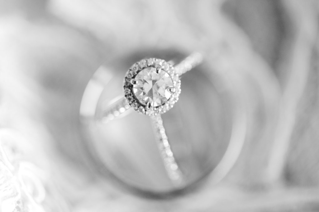 Engagement ring and wedding bands in black and white