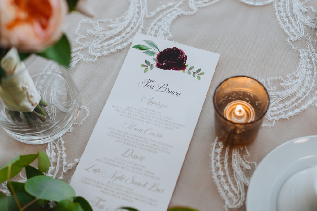 wedding menu and place card on champagne table cloth