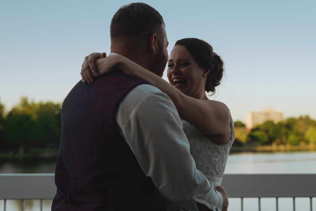 first dance on patio overlooking dows lake at sunset