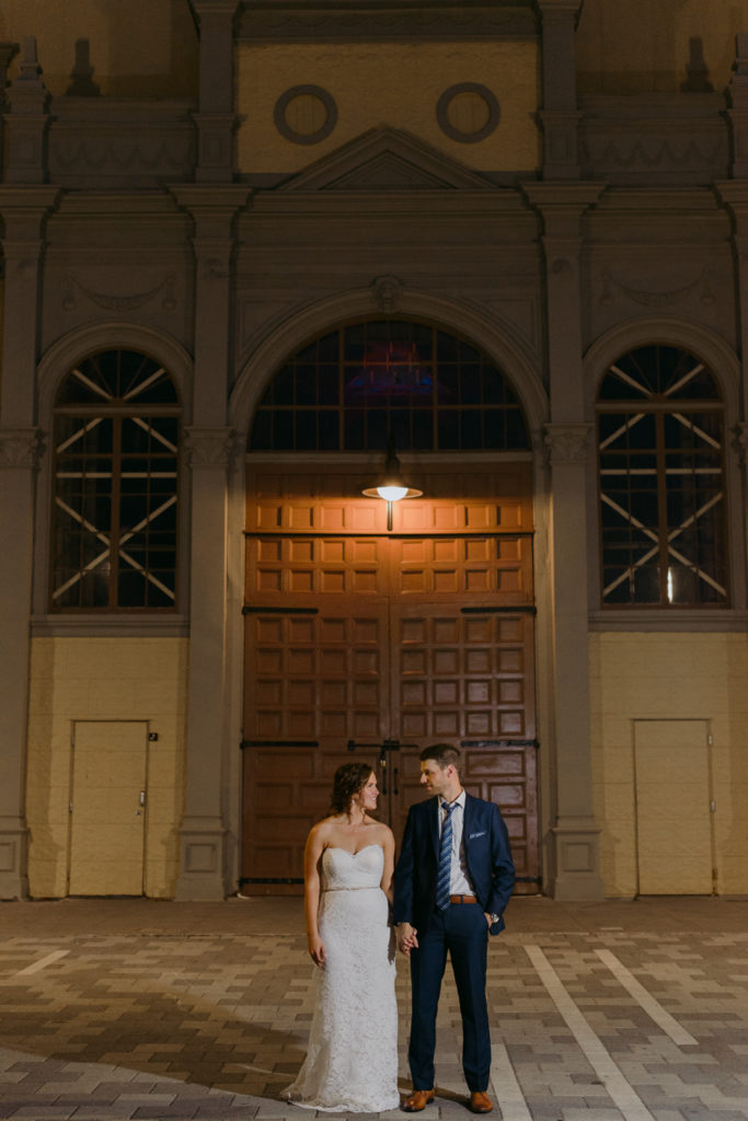 bride and groom in front of the Aberdeen Pavilion at night
