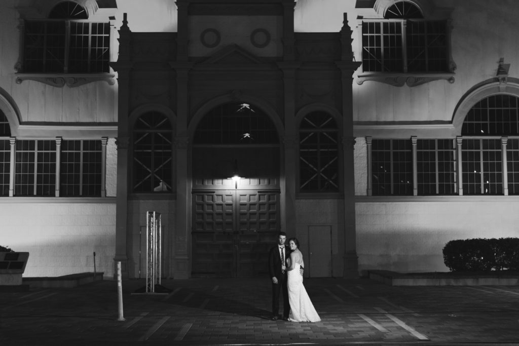 bride and groom in front of the Aberdeen Pavilion at night