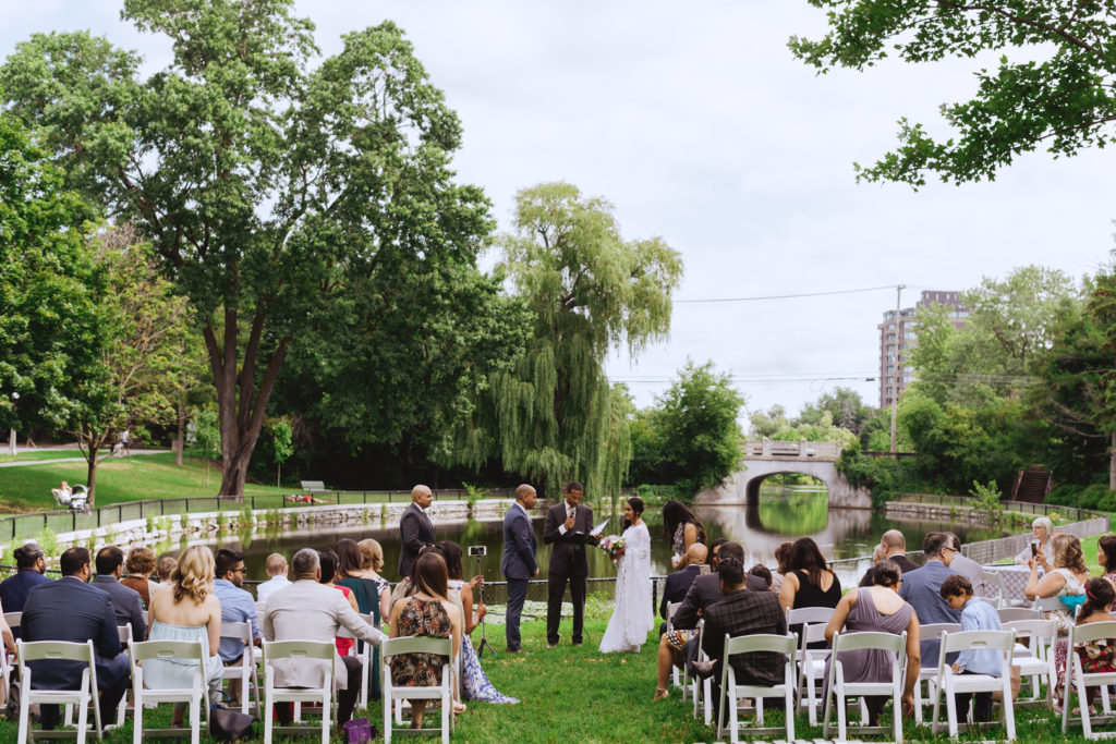 ceremony at Patterson's Creek surrounded by willow trees and a pond