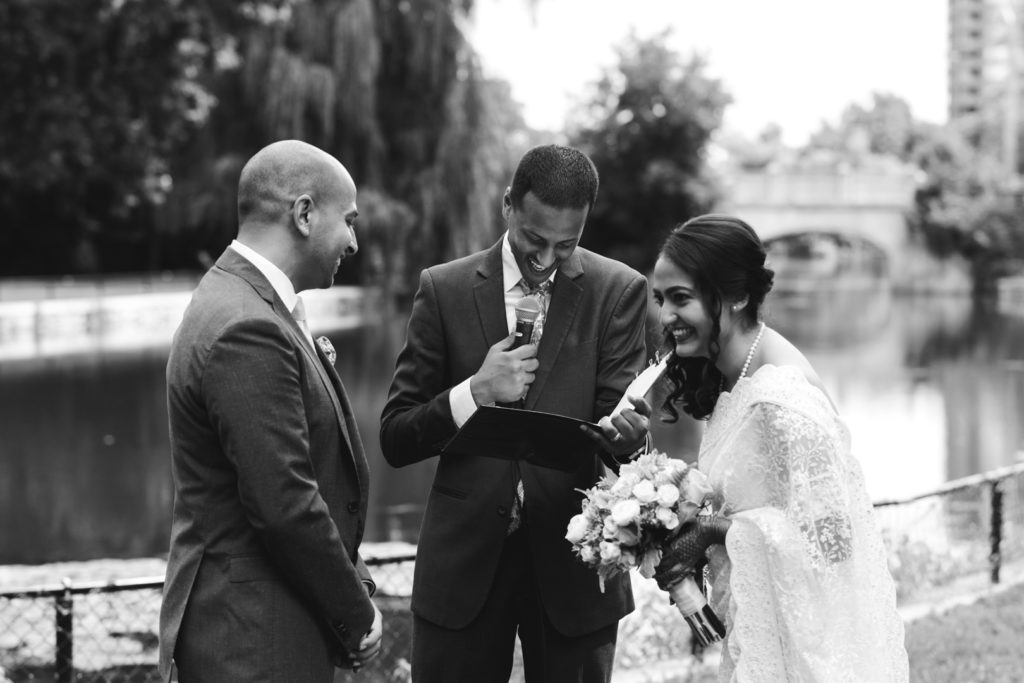 bride and groom laughing during wedding ceremony