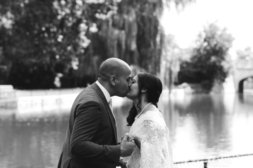 bride and groom first kiss outdoors at Patterson's Creek