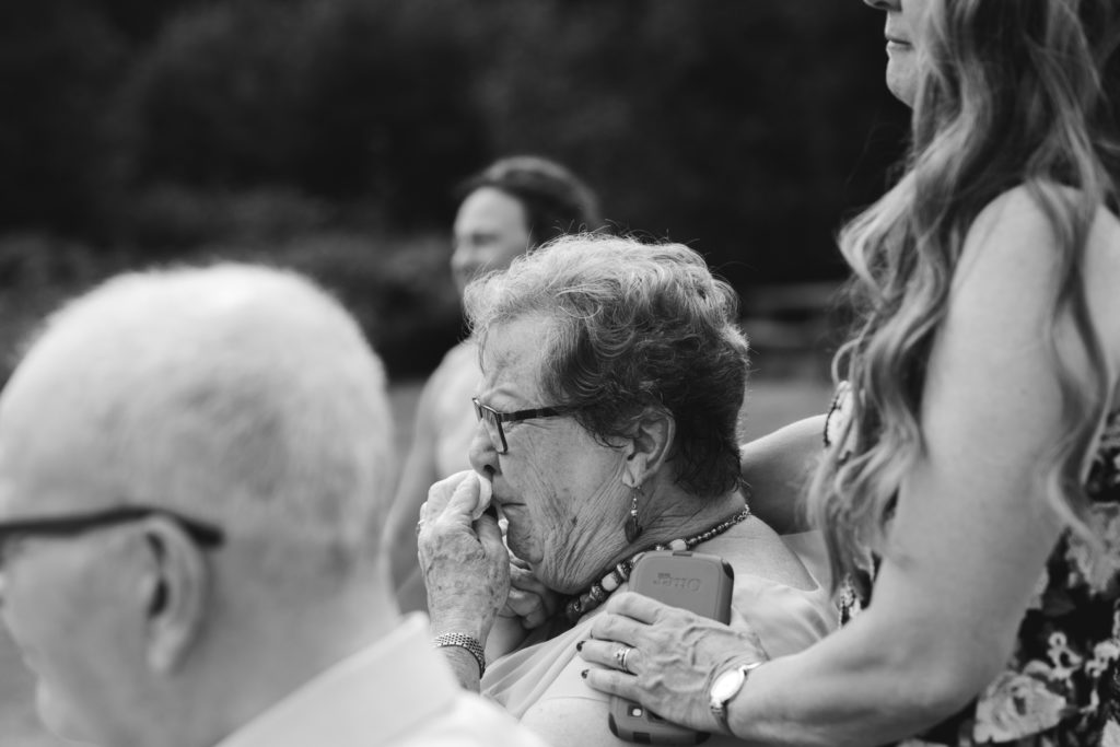 groom's grandmother crying during wedding ceremony