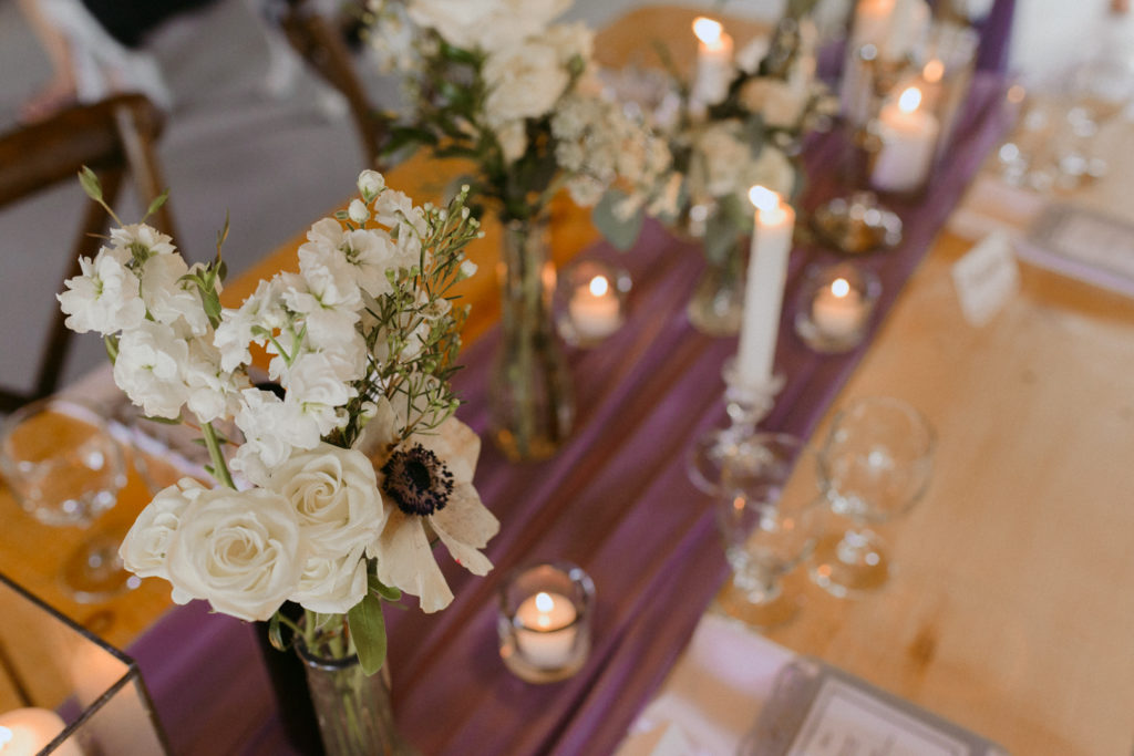 wedding reception decor with flowers and candles