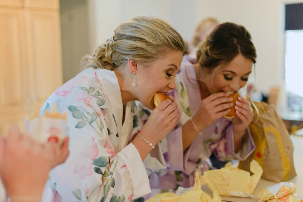 bride and bridesmaids eating McDonalds before the wedding