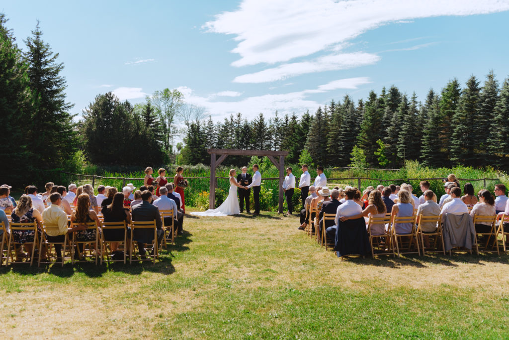 wedding ceremony at Saunders Farm on a bright sunny day
