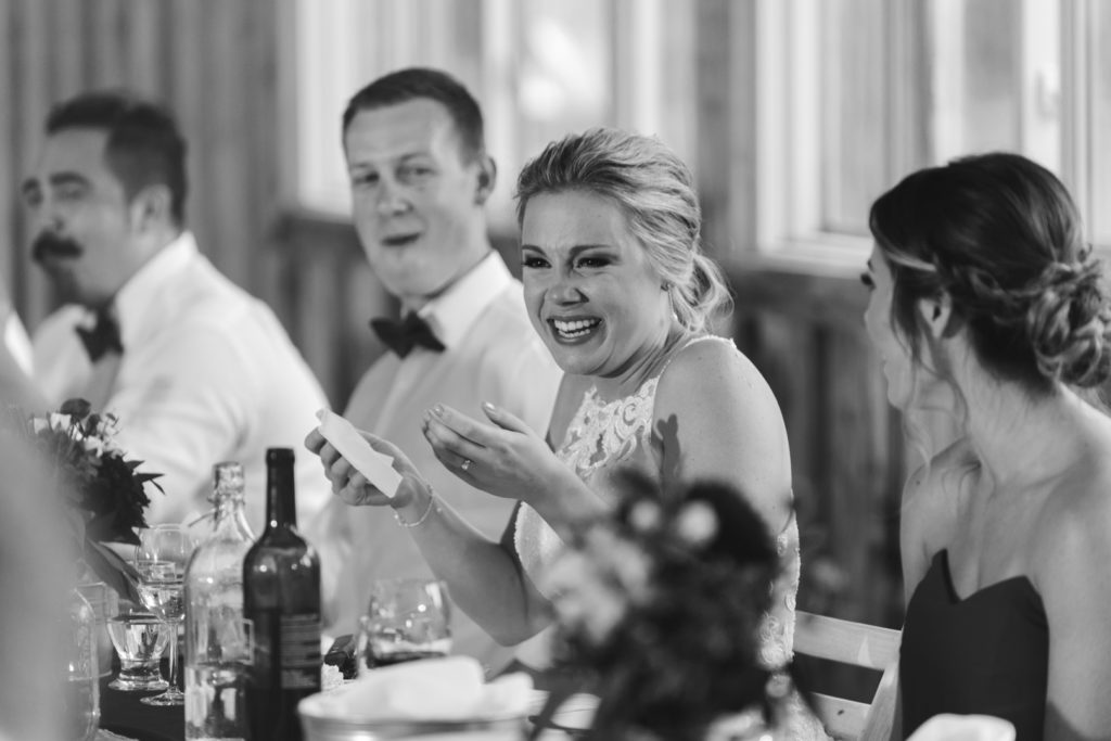bride laughing at maid of honour speech