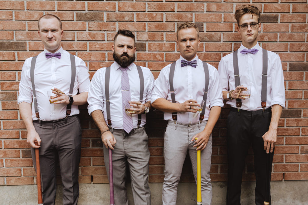 groomsmen with baseball bats and scotch