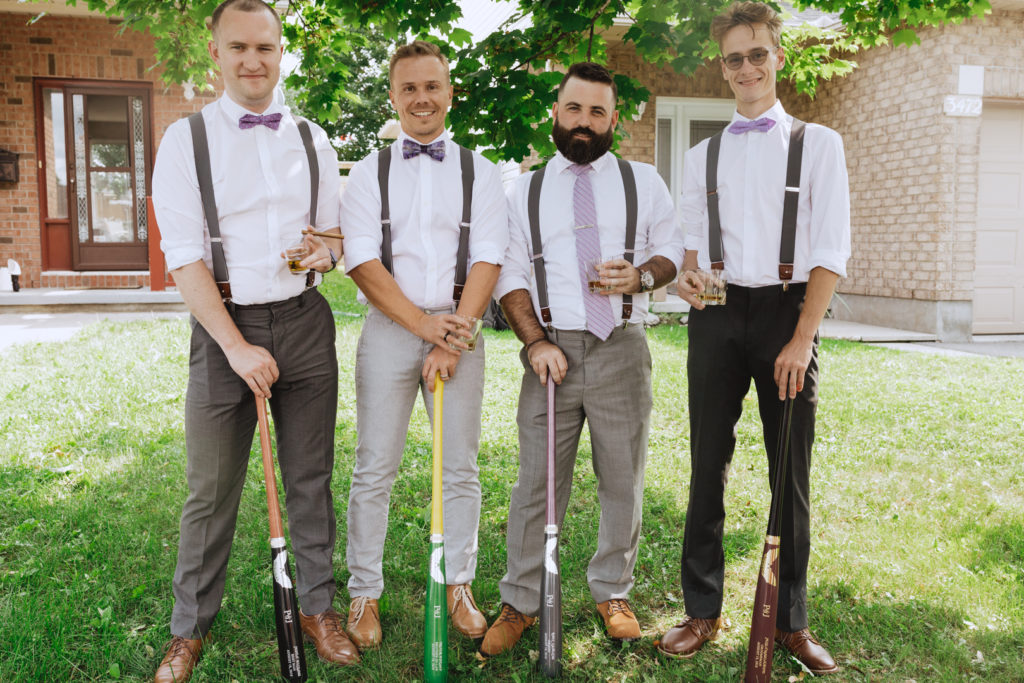 groomsmen with baseball bats and scotch