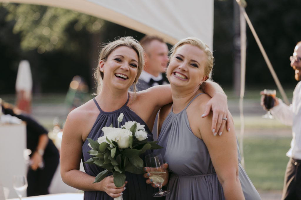 bridesmaids smiling during cocktail hour