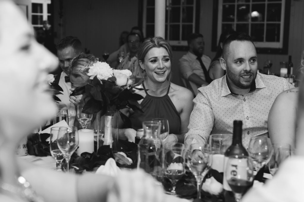 bridesmaid laughing at bride and groom speech