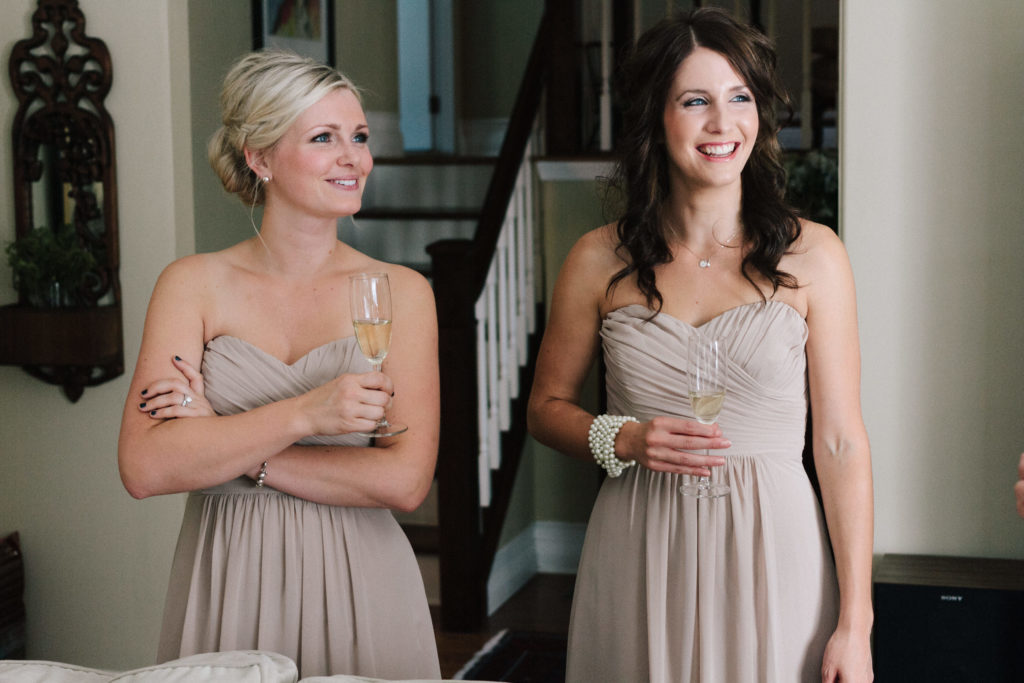 bridesmaids sipping champagne