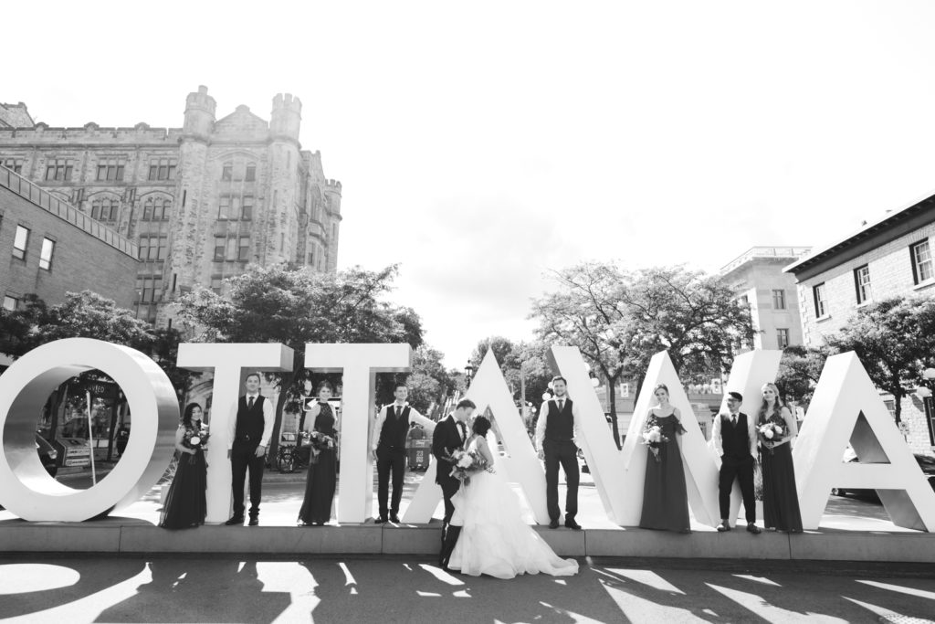wedding party in front of Ottawa sign