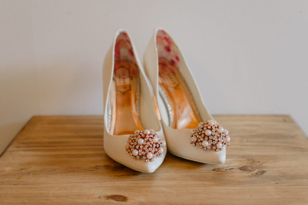 Ted Baker wedding shoes on a wooden table