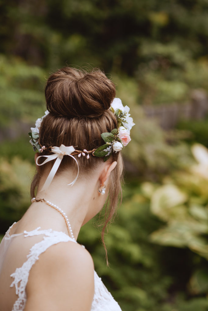 bride's top knot with floral crown