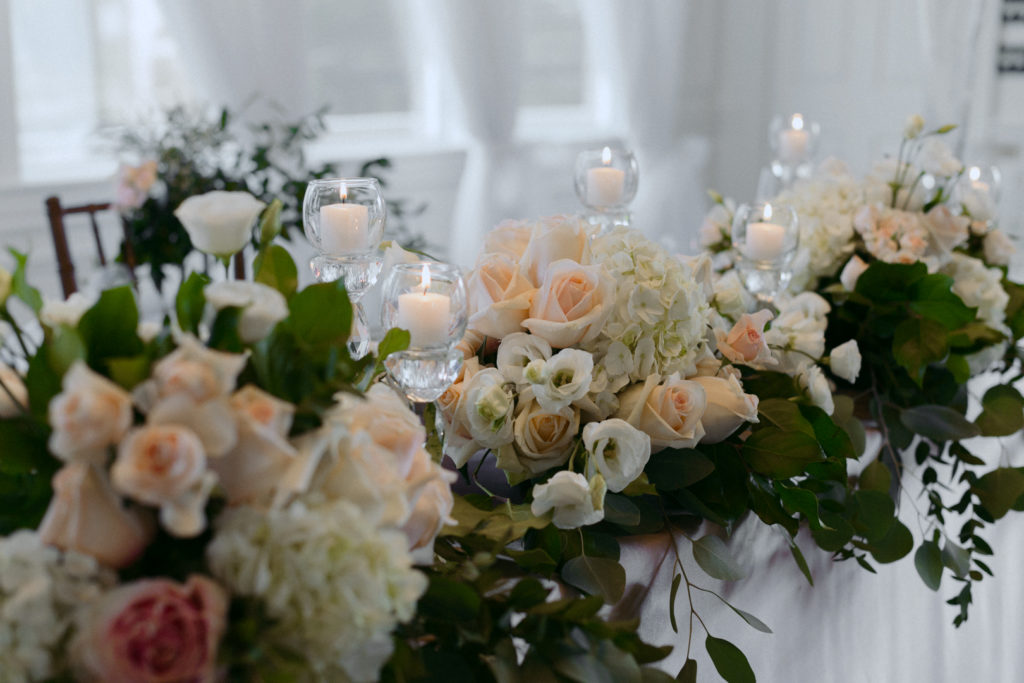 blush, green and gold head table with candles