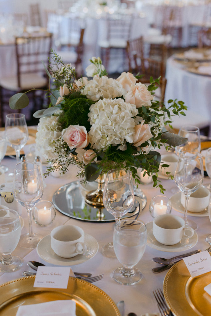 hydrangea centrepiece at blush and gold wedding reception
