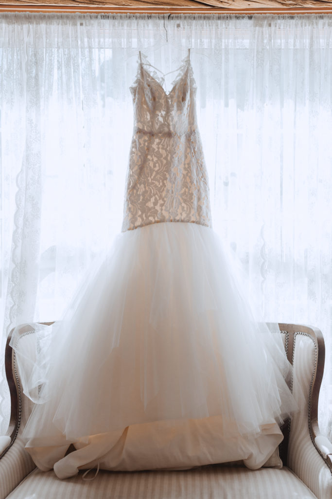 Hayley Paige wedding dress hanging in window