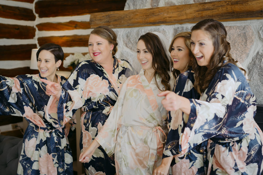 bride and bridesmaids doing boomerang in floral robes