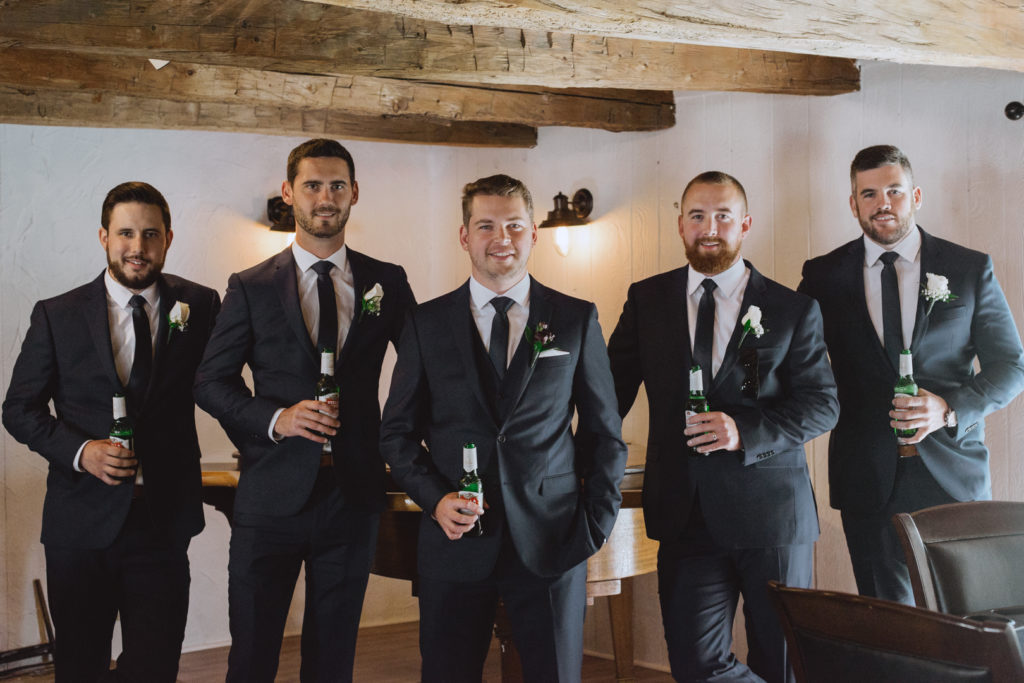groom and groomsmen drinking beer in the Badchild's Pub at Stonefields