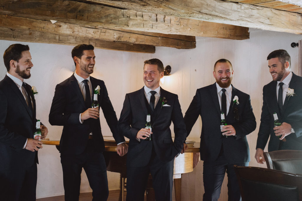groom and groomsmen drinking beer in the Badchild's Pub at Stonefields