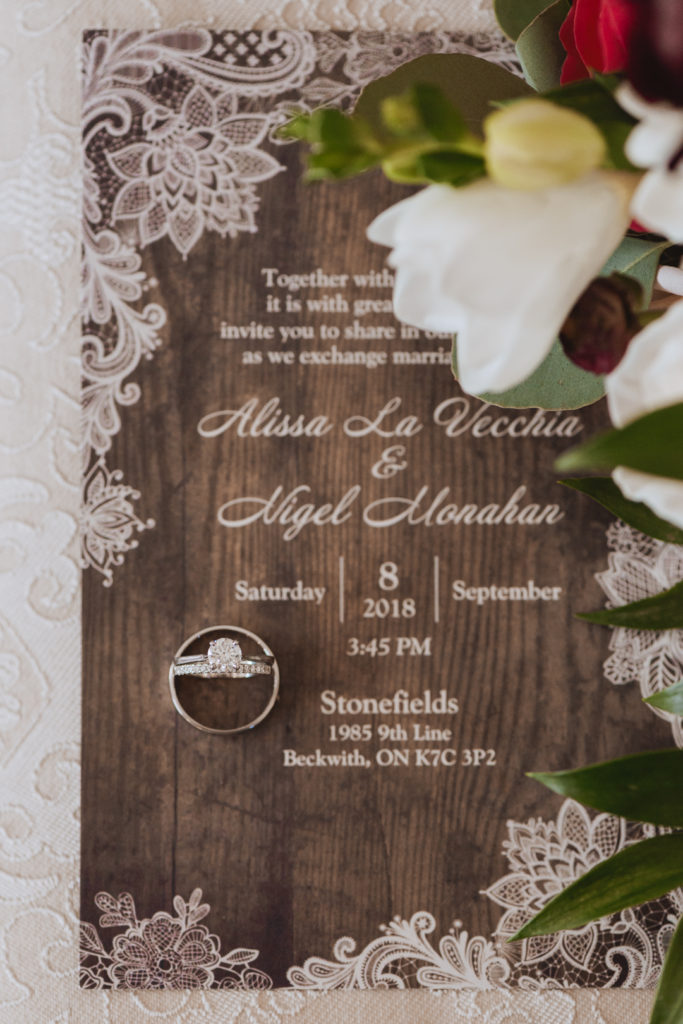 invitation and wedding rings