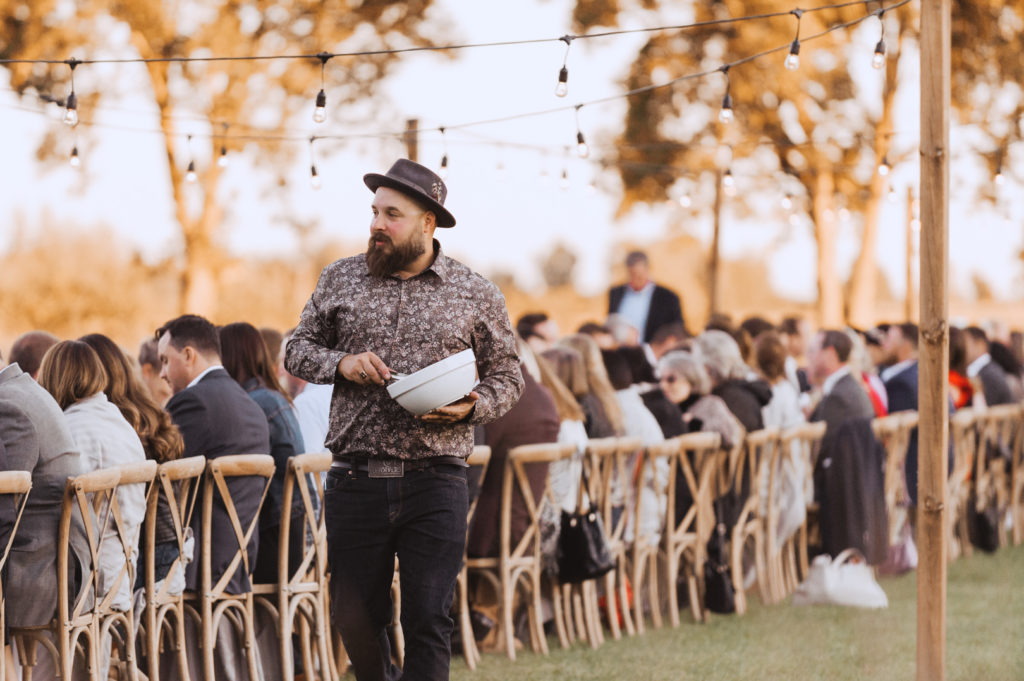 whalesbone catering serving dinner at backyard wedding in Ottawa