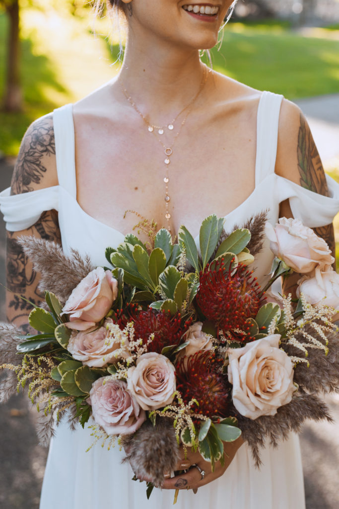 bride holding bouquet smiling