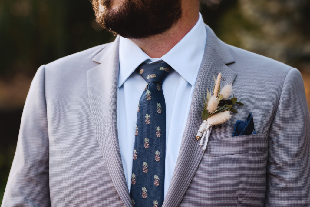 groom wearing pineapple tie