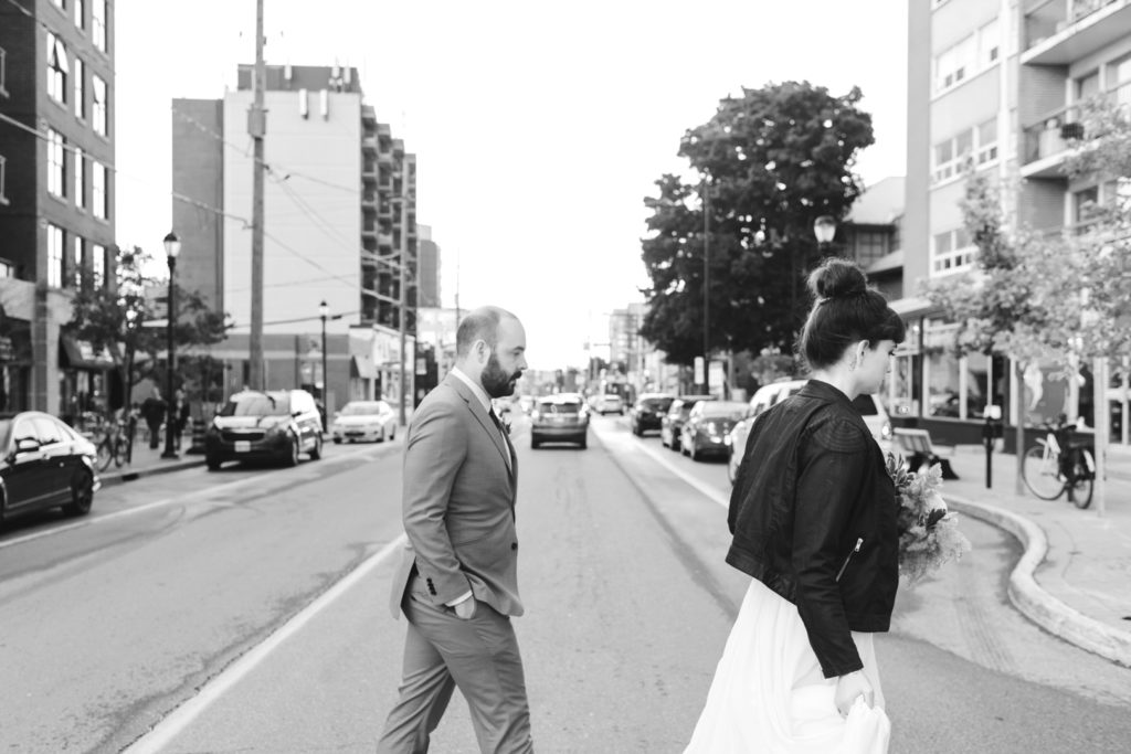bride and groom crossing Wellington Street in Ottawa