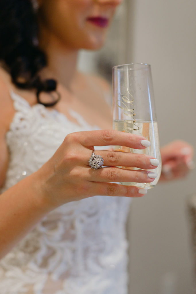 bride holding a champagne class