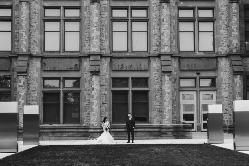 bride and groom standing in front of Museum of Nature in Ottawa