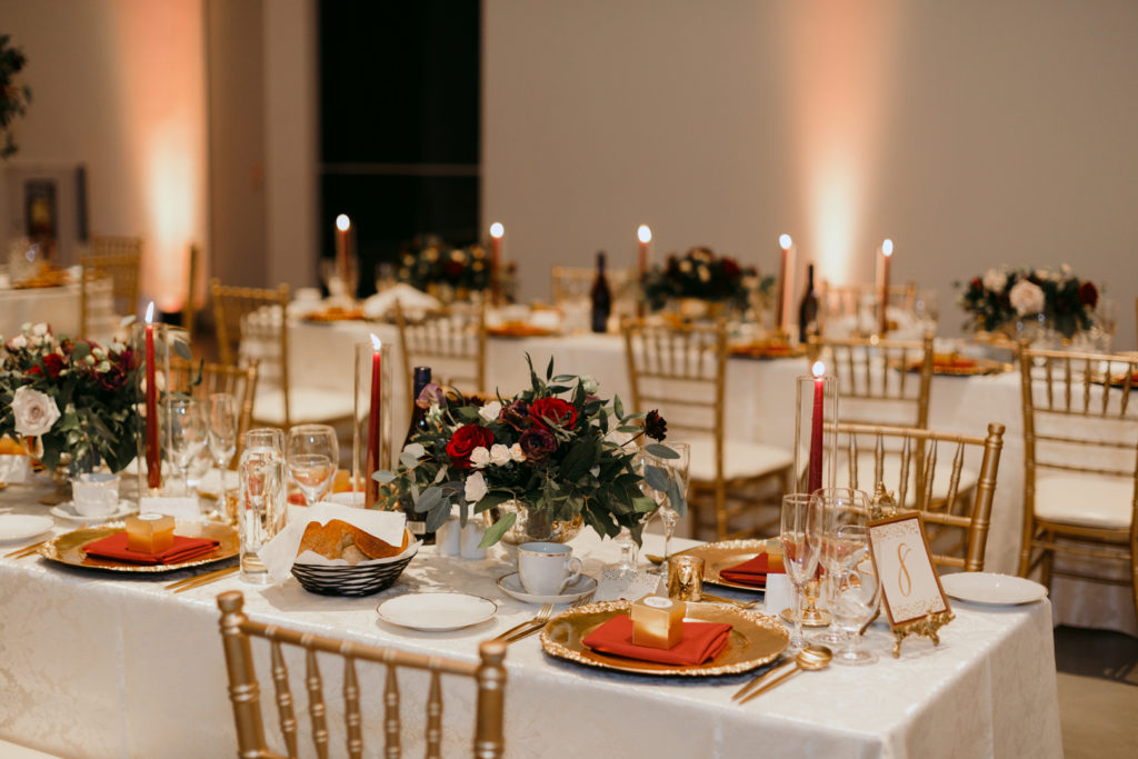 gold and red wedding reception decor at the Museum of Nature in Ottawa