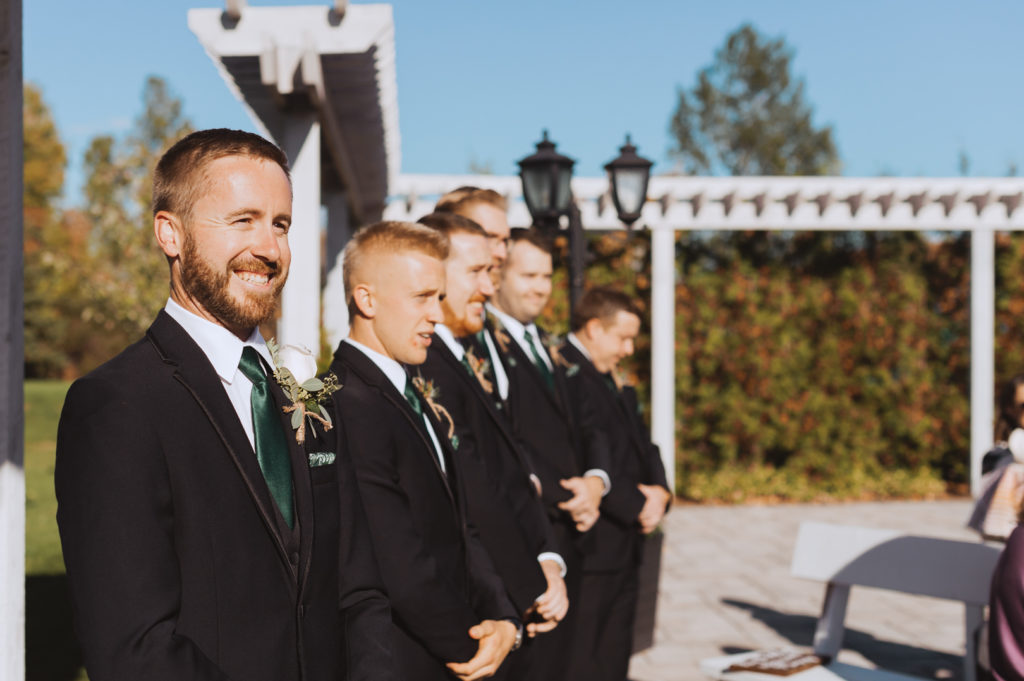groom seeing the bride for the first time during outdoor ceremony