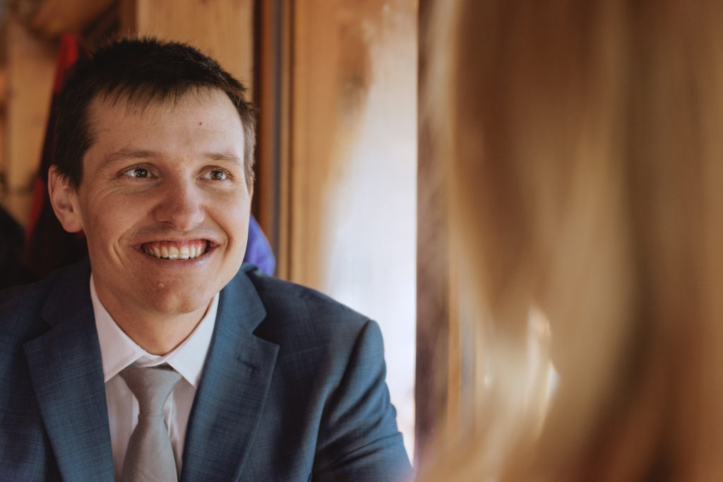 groom smiling at bride in the pub