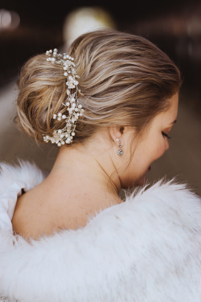 bride wearing beaded hair piece