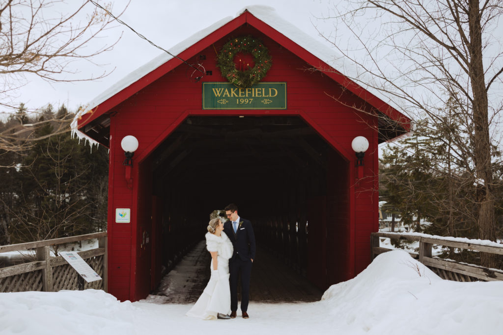 bride and groom outside of Wakefield covered bridge
