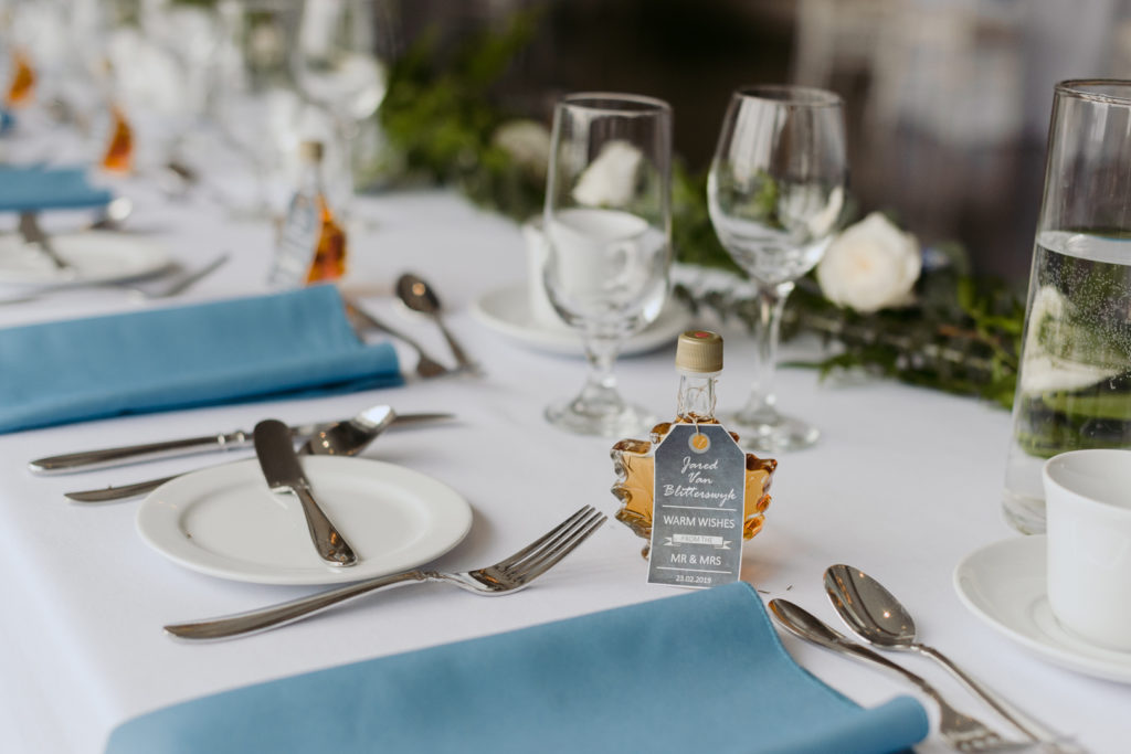 table settings with blue napkins at Le Belvedere
