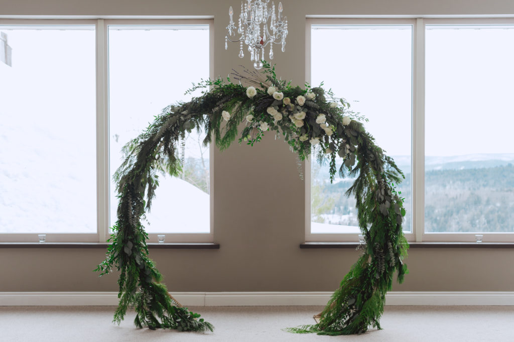 cedar arch with white flowers