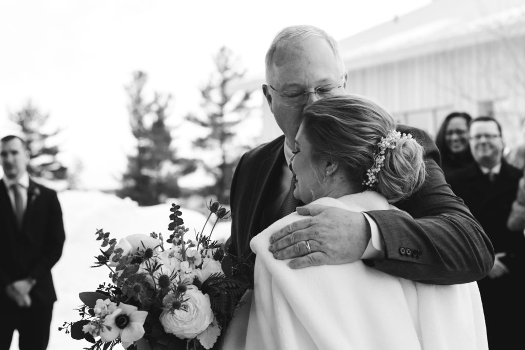 father of the bride giving away his daughter