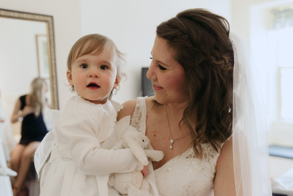 bride with her daughter before wedding ceremony