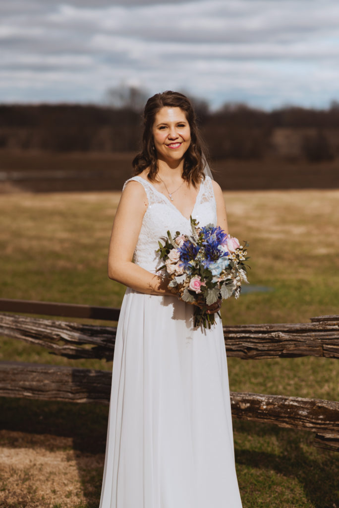 bride in the sunlight in a field